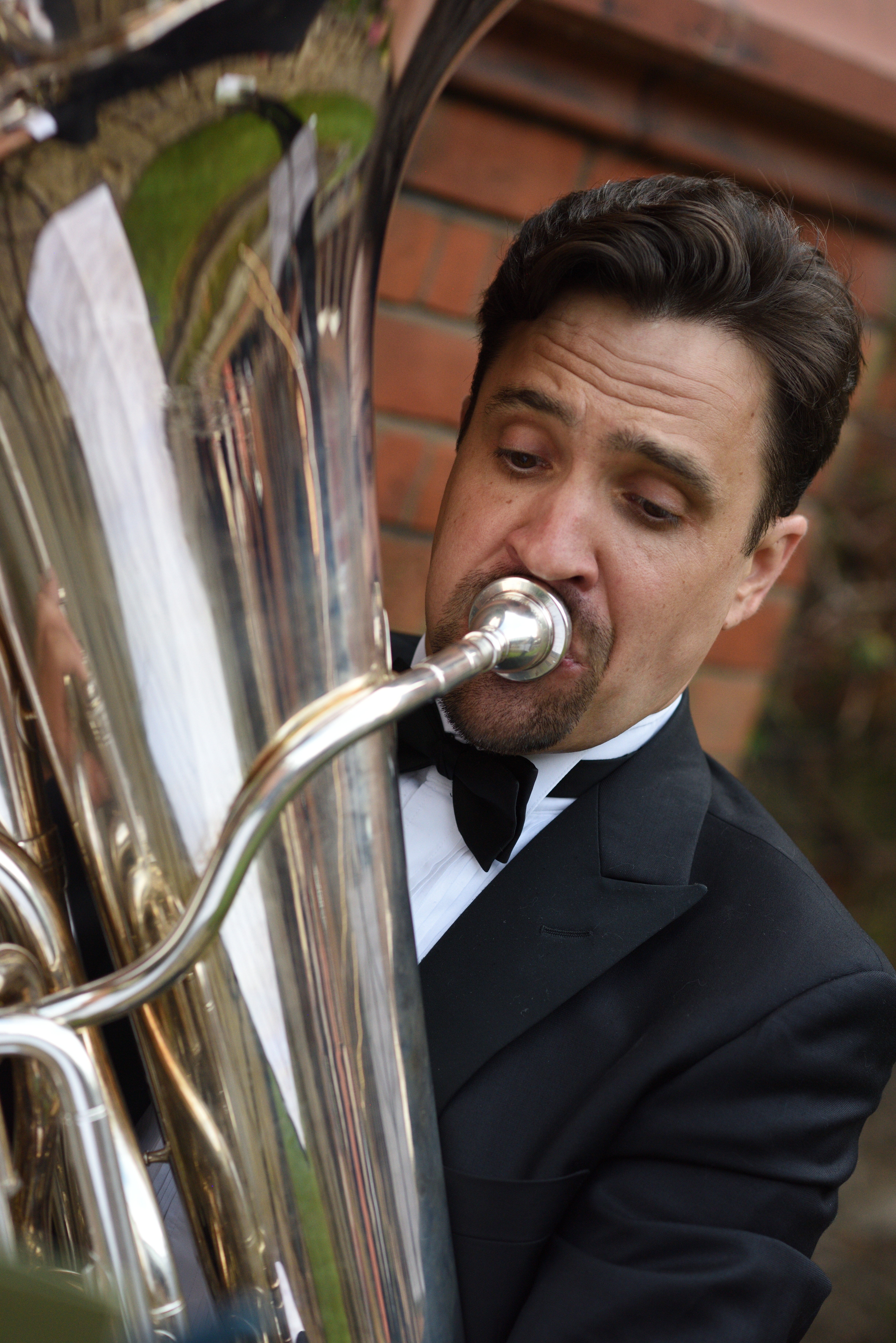 Andy Kershaw performing with brass instrument