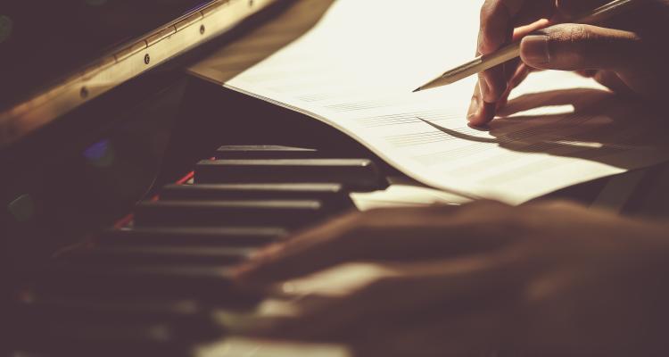 composing music at piano