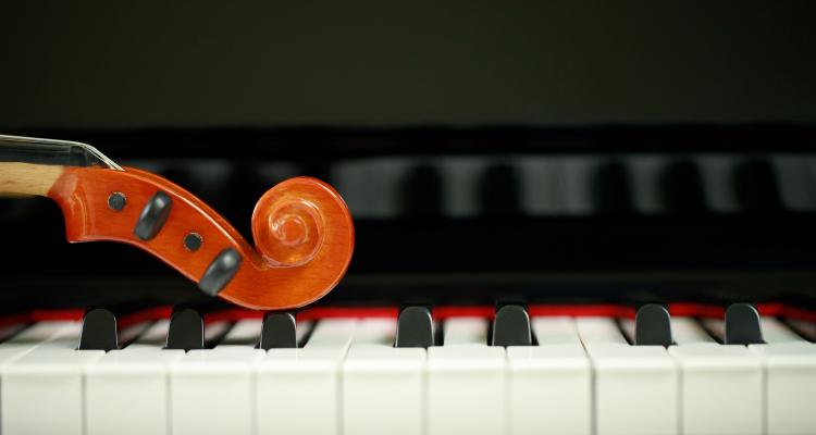 Violin place on piano keys