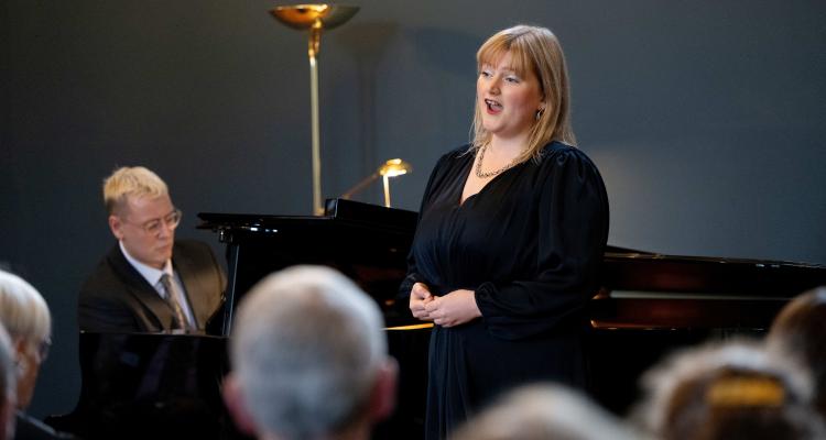 Edward Campbell-Rowntree and Georgie Malcolm performing in Old Hall at Girton College's Roll of Alumni Weekend 2024