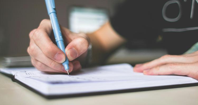 hand writing in a notebook