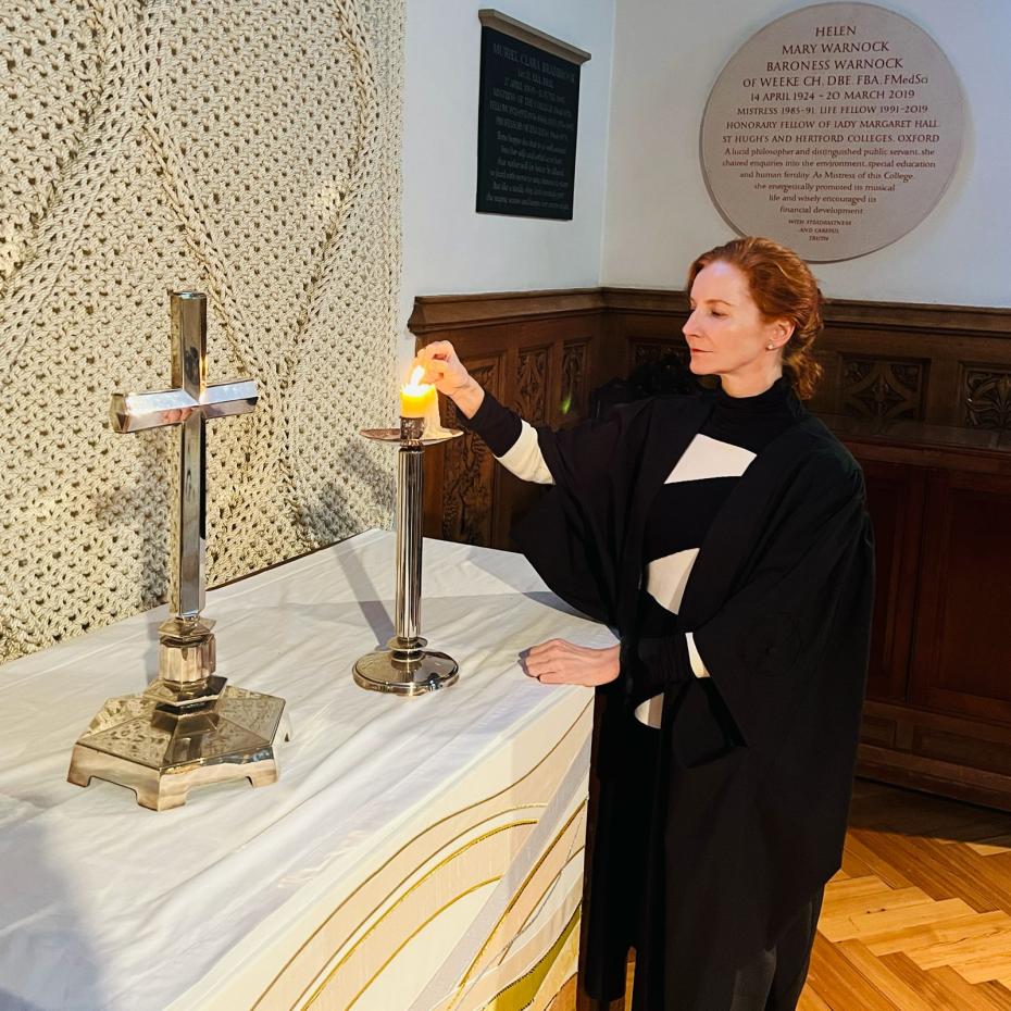 The Mistress lights a candle